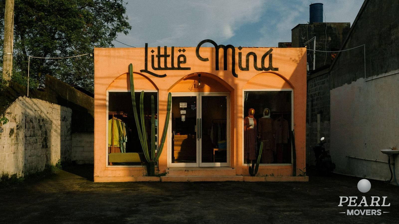 A small retail storefront exterior with display windows